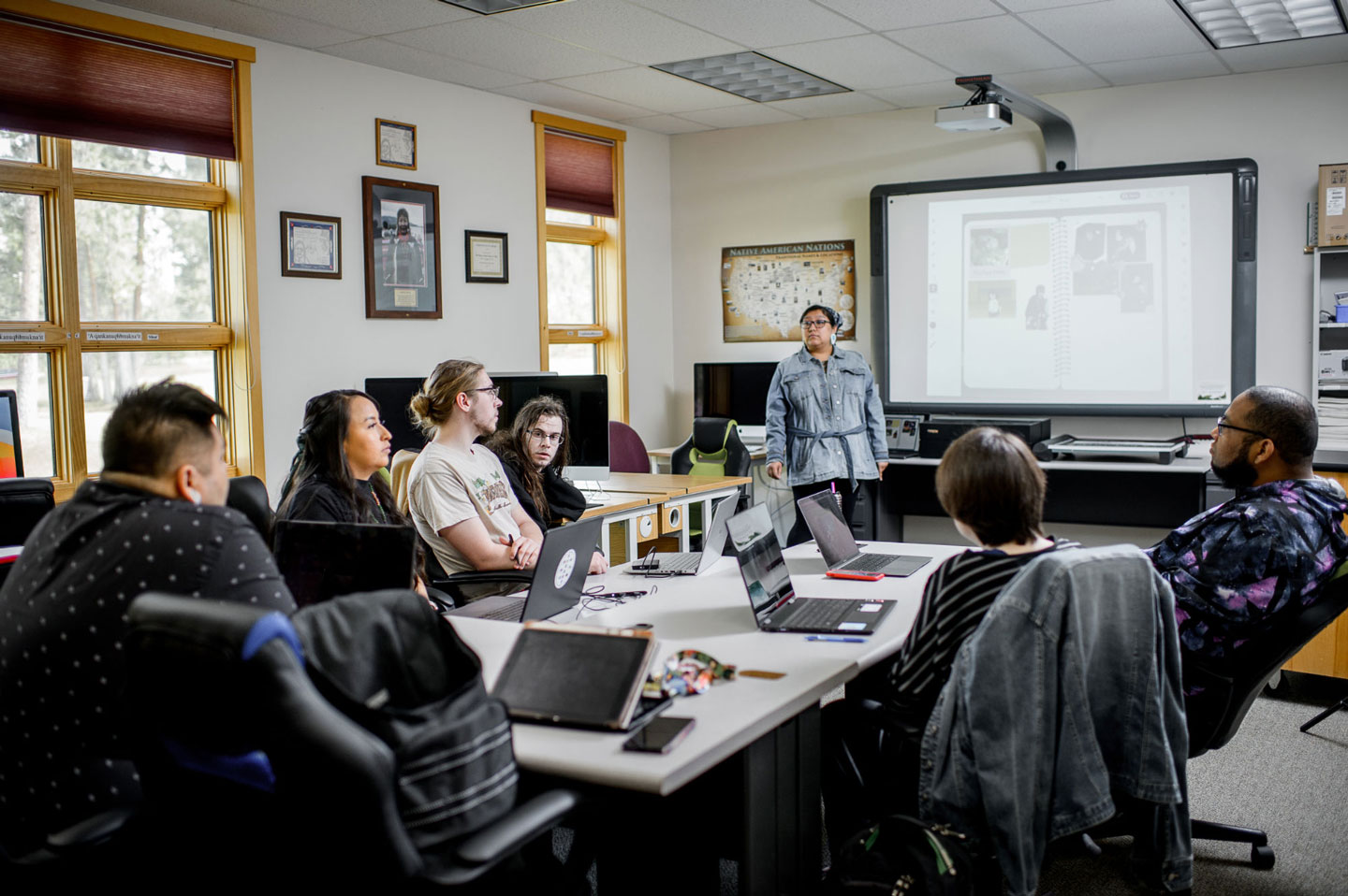 A group of students learning in a classroom setting.