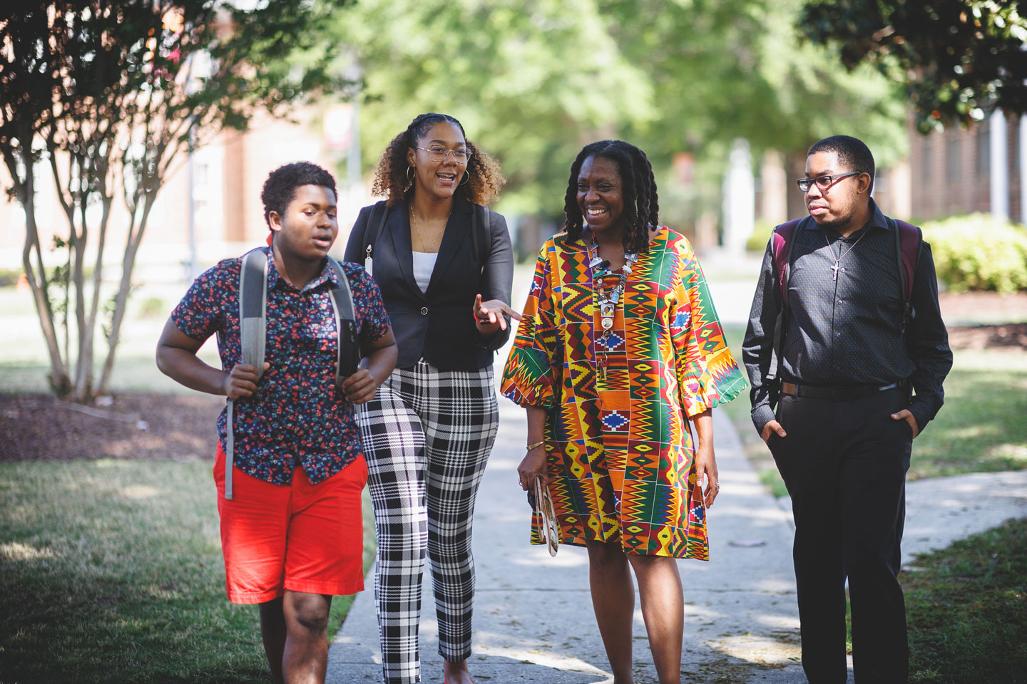 Group of students walking through campus.