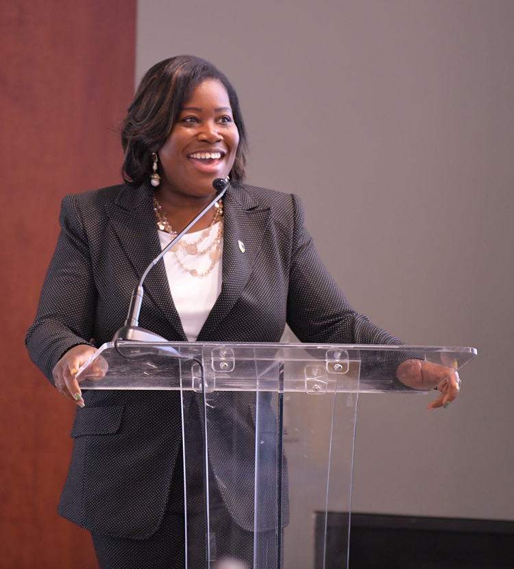 Dr. Dionne Curbeam speaking at an event.