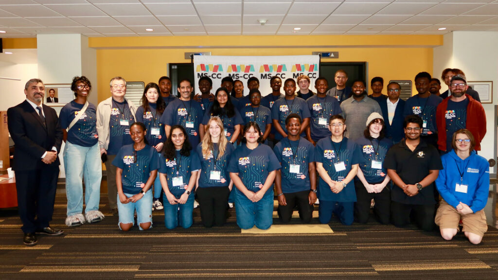 Large group of MS-CC hackathon participants taking a group photo.