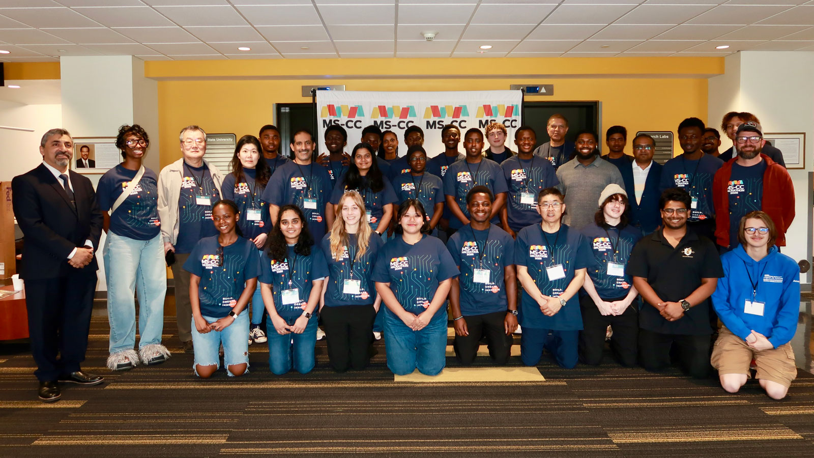 Large group of MS-CC hackathon participants taking a group photo.